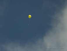 Helium filled balloon high overhead